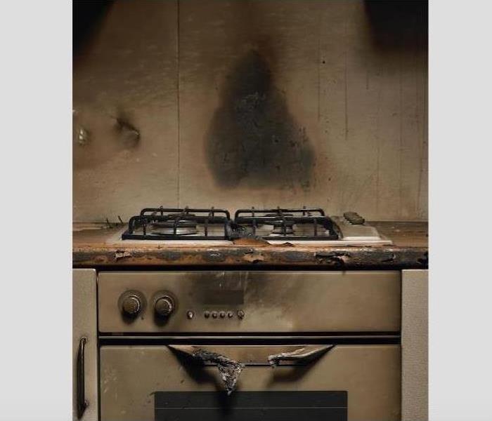 burned and charred kitchen range